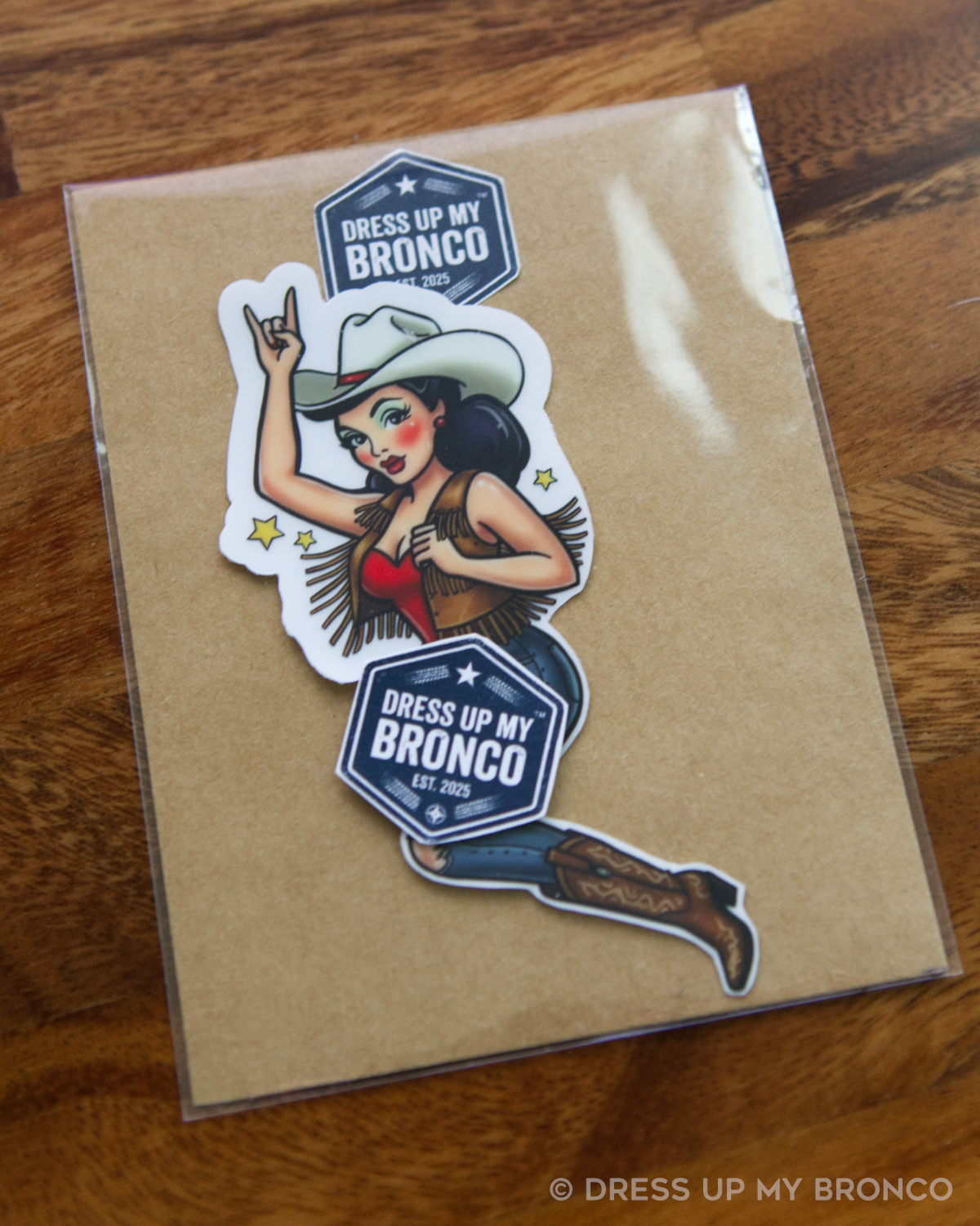 Brunette Cowgirl Bronco Bombshell — Bucking Emblem Vinyl Decal (Pin-Up Edition)